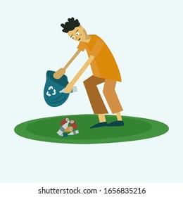 guy collects trash from the lawn into a trash bag