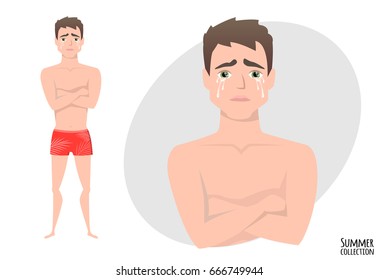 The guy crossed his arms and cries. Mans tears and depression. The emotion of disappointment and sadness at the boys face. The male was crying. Men in a beach swimming trunks