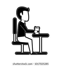 Guy in desk with coffee