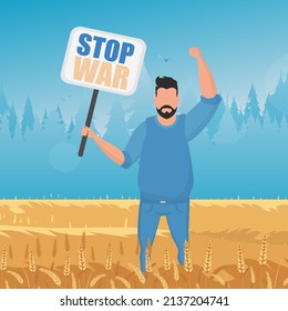The guy in full growth holds a poster with the inscription Stop the war. Rural landscape with wheat field and blue sky in the background.