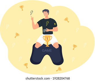 El trofeo de los jugadores de Guy. Hombre joven sentado en la mesa de juego con el símbolo de la copa de oro de la victoria y el liderazgo. Desarrollador, jugador de ciberdeporte o jugador ganó la competencia en línea y obtuvo el premio. Coincidencia en línea
