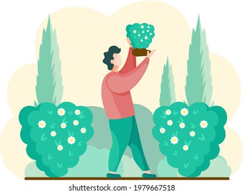 Plantas de jardinería en el patio trasero, flores en un hermoso arbusto, disfrutando de flores en el jardín de primavera. Jardín de pie con ramo en las manos. Horticultura orgánica. el trabajador se dedica a la jardinería