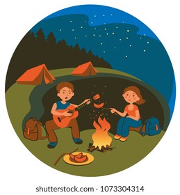 Guy and girl camping in the woods and frying sausages on a camp fire