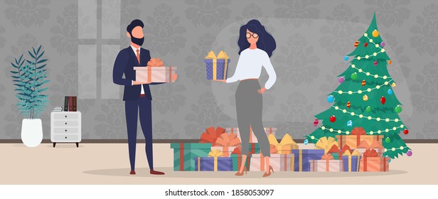 A guy and a girl give each other gifts for the new year. Christmas tree, gifts, family. Holiday concept. Vector.