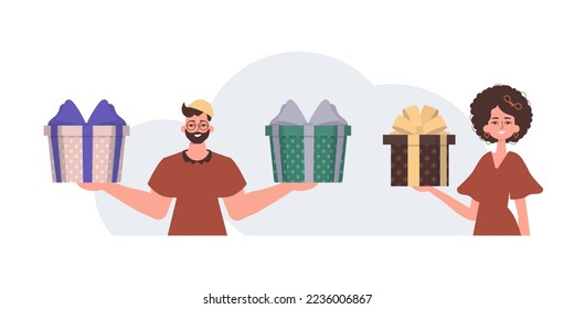The guy and the girl are holding gift boxes. Christmas gift concept.