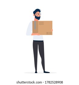 A guy with glasses holds a box in his hands. The man is holding a cardboard box. Isolated. Vector.