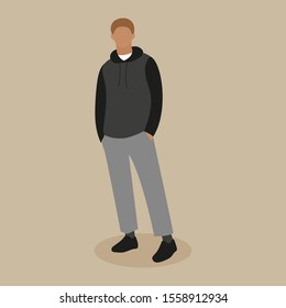 Guy with hands in pockets on a beige background