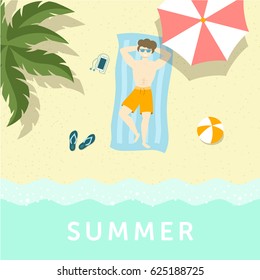 Guy having sunbathe on the sea shore under palm tree and umbrella.