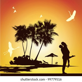 guy holding a girl on the seashore