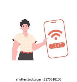 Der Typ hält ein Telefon mit dem IoT-Logo in den Händen. Internet der Dinge und Automatisierungskonzept. Trendy flach Stil. Vektorgrafik.