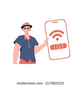The guy is holding a phone with the IoT logo in his hands. Internet of things and automation concept. Vector illustration in flat style.