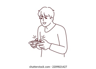 Guy with joystick playing computer games at home. Young man with joypad have fun engaged in videogame. Addiction and hobby. Vector illustration. 