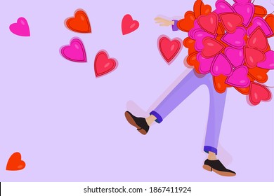 The guy lay under the hearts. Heap of greeting valentines on the person. Male feet