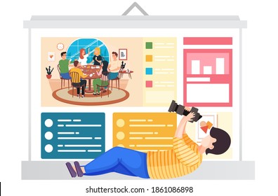Guy lies and takes pictures of a poster with an image. Friends at the table are playing a board game. Photographer during a billboard photo session of spending time together. People playing cards