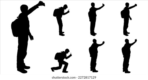 A guy looking at the phone screen, and shooting a video. Teen talking with a friend using video call, taking pictures for memories. Boy taking photos by cell phone. Black silhouette isolated on white
