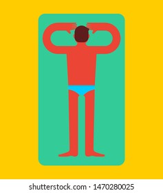 Guy is lying and sunbathing. Man on beach tanning. Summer rest