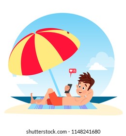 The guy on the beach under the umbrella writes a message. Holidays.