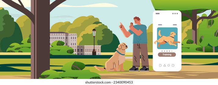 guy owner with cute dog walking in park and using training app on smartphone screen best friends domestic animal friendship concept