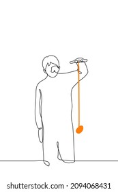 guy plays with yo yo toy orange color - one line drawing vector. concept of adults playing children toys 