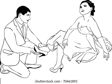 guy puts on a shoe to his girlfriend