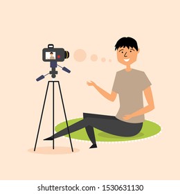 The guy is recording a video blog on a SLR camera. Modern blogger. Vector