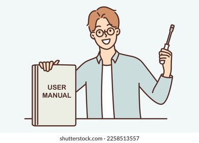 Guy with screwdriver proudly shows book with inscription user manual recommending use of educational literature. Man repairman in casual clothes advice to follow rules from user manual