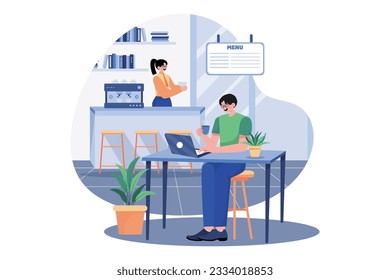 The Guy Sits At A Laptop In A Cafe