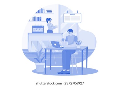 The Guy Sits At A Laptop In A Cafe