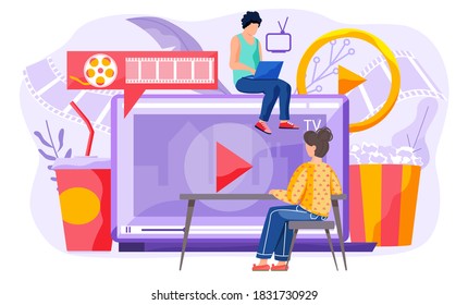 The guy sits at the monitor and works on his computer. The girl sits at the table and watches a movie on the screen. Online cinematography. Cinema on the internet with a popcorn and a coctail