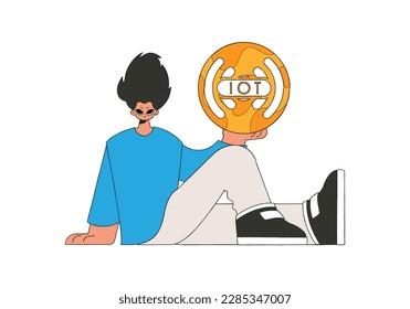 Guy sits on floor, holding internet of things logo.