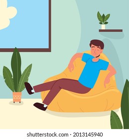 guy sitting in bean bag chair at home
