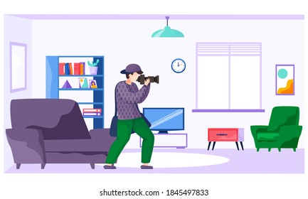 The guy standing and adjusting the lens. Photographer with a camera makes pictures in the apartment. Taking photos at home. Photographic art. A cameraman prepares camera for a future photo shoot