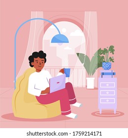 Guy working from home with his laptop sitting in front of window. Stay Home, Stay Safe.