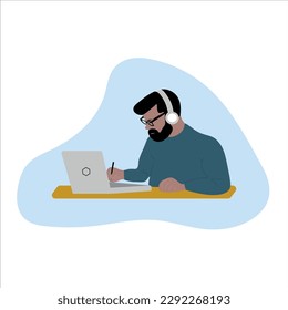 A guy, a young man, sitting at a desk with a computer, studying, working online