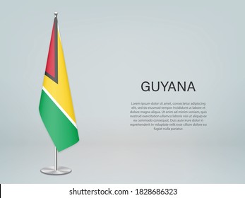 Guyana hanging flag on stand. Template for politic conference banner