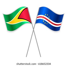 Guyanese and Cabo Verdean crossed flags. Guyana combined with Cabo Verde isolated on white. Language learning, international business or travel concept.