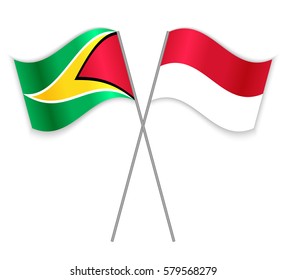 Guyanese and Monegasque crossed flags. Guyana combined with Monaco isolated on white. Language learning, international business or travel concept.