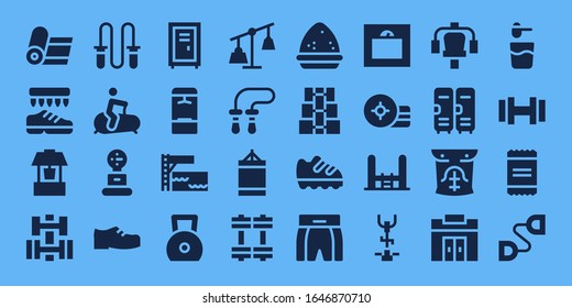 gym icon set. 32 filled gym icons. on blue background style Simple modern icons such as: Yoga, Shoes, Well, Dumbbell, Jumping rope, Stationary bike, Weight, Locker, Trampoline