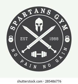 Gym logo in vintage style. Vector illustration. 