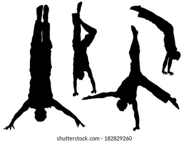 Gymnast man in a jump on white background