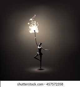 gymnastic girl holding a torch in the darkness could be used in Olympic games and sports opportunities .