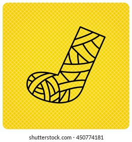 Gypsum or cast foot icon. Broken leg sign. Human recovery medicine symbol. Linear icon on orange background. Vector