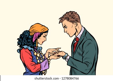 a Gypsy telling fortunes by the hand to the businessman. A fortune-teller palmist. Pop art retro vector illustration kitsch vintage