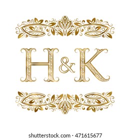 H and K vintage initials logo symbol. The letters are surrounded by ornamental elements. Wedding or business partners monogram in royal style.