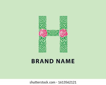 H letter ecology logo from rose flower and green leaves font style vector icon