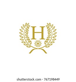 H letter with leaf and flower golden luxury logo design vector
