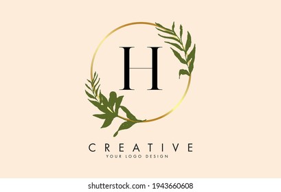 H Letter logo design with golden circles and green leaves on branches around it. Vector Illustration with H letter for personal branding, corporate, business, eco friendly or natural products. 