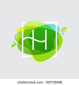 H letter logo in square frame at green watercolor splash background. Green art. Vector ecology typography for your posters, invitations, cards. 