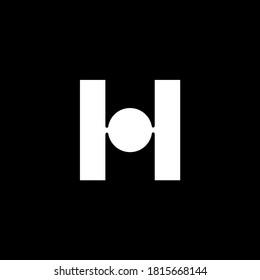 H letter made with two vertical slab and  a solid circle 