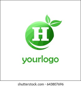 H letter organic market logo. Eco green food brand identity. Fresh apple with letters in a circle with leaves.